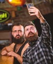 Online communication. Man bearded hipster hold smartphone. Taking selfie concept. Send selfie to friends social networks Royalty Free Stock Photo