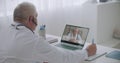 Online council of professors of medicine by video chat, male doctors are conferring remotely by internet