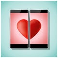 Online dating concept Love has no boundaries with two smartphones matching red heart on screen Royalty Free Stock Photo