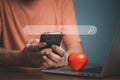 Online dating service searching concept. Man hand holding smartphone with red heart on the mobile phone. Royalty Free Stock Photo