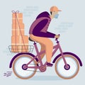 Online delivery service. A man in a medical mask on a bicycle is in a hurry to deliver an order to customers