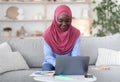 Online Design Courses. Young African Muslim Lady Studying With Laptop At Home