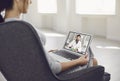 Online doctor.A sick young woman video chat with a male doctor at home.