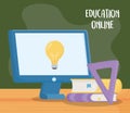 Online education, computer books ruler in desk