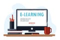 Online education concept design with a computer, books, hot drink. E-learning