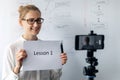 online education, webinar and business vlog concept - woman teaching and recording video with phone Royalty Free Stock Photo