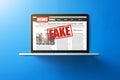 Online fake news on a laptop screen. Royalty Free Stock Photo