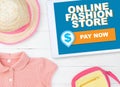 Online fashion store on screen with pay now button Royalty Free Stock Photo