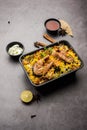 Online Food Delivery - Fish Pulao Or Biryani packed in Plastic box Royalty Free Stock Photo