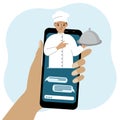 Online food shopping on mobile phone or fast food delivery order. The cook holds a tray with a lid or a plate with a Royalty Free Stock Photo