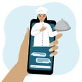 Online food shopping on mobile phone or fast food delivery order. The cook holds a tray with a lid or a plate with a Royalty Free Stock Photo