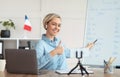 Online French lesson. Foreign languages tutor teaching class on webcam, talking to students, showing thumb up at home