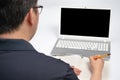 Online learning concept. A man who is receiving online learning using a laptop Royalty Free Stock Photo