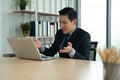 Online learning, Meeting, working and E learning concept. Casual Asian business man studying online course, meeting via computer. Royalty Free Stock Photo