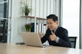 Online learning, Meeting, working and E learning concept. Casual Asian business man studying online course, meeting via computer. Royalty Free Stock Photo