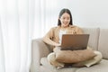 Online lifestyle concept A female home worker paying attention on the online meeting with her co-workers Royalty Free Stock Photo