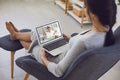 Online medical consultation..A sick young woman video chat with a male doctor sitting at home. Royalty Free Stock Photo