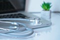 Online medical support symbolized by a stethoscope lying on a computer keyboard. Royalty Free Stock Photo