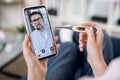 Online medicine concept. Close up screen view of confident bearded doctor communicates with his patient via a video call