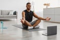African American Guy Doing Yoga At Laptop Meditating At Home Royalty Free Stock Photo