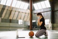 Online meditation. Mind- soul- body balance. Caucasian sportswoman wearing medical mask praying in front of laptop computer screen