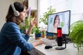Online meeting of teenagers friends, guy at home talking with smiling girl Royalty Free Stock Photo