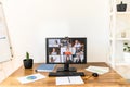 Pc screen with video conference on the table Royalty Free Stock Photo