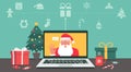 Santa Claus hand greeting via video calling on the laptop with Christmas icon