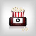 Online movie theater concept illustration. Vector popcorn basket and smartphone with movie theatre background with white Royalty Free Stock Photo