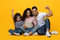 Online Offer. Happy arab family of three celebrating success with digital tablet Royalty Free Stock Photo