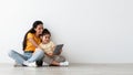 Online Offer. Smiling Arab Mother And Little Daughter Using Digital Tablet Together Royalty Free Stock Photo