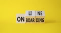 Online Onboarding symbol. Turned wooden cubes with words Online Onboarding. Beautiful yellow background. Business and Online