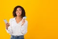 African american girl holding credit card and smartphone Royalty Free Stock Photo