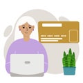 Online payment concept. Close up of a large credit card. A woman holding a laptop in his hand. Royalty Free Stock Photo