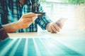 Online payment, man's hands holding a credit card and using smar