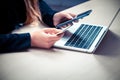 Online payment, women`s hands holding a credit card and using smart phone for online shopping Royalty Free Stock Photo