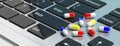 Online pharmacy. Pills capsules on computer keyboard. 3d illustration Royalty Free Stock Photo
