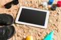 Online poker game on the beach with digital tablet and stacks of chips. Top view Royalty Free Stock Photo