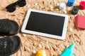 Online poker game on the beach with digital tablet and stacks of chips. Top view Royalty Free Stock Photo