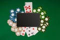 Online poker game with digital tablet, chips and cards Royalty Free Stock Photo