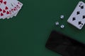 Online poker games. four aces with dice and phone in casino Royalty Free Stock Photo