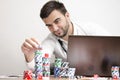 Online poker stacking chips while smiling Royalty Free Stock Photo