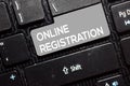 Online Registration write on keyboard isolated on laptop background