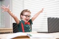 Online remote learning. Excited school kids with computer having video conference chat with teacher in class. Child Royalty Free Stock Photo