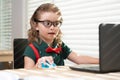 Online remote learning. School kids with computer having video conference chat with teacher in class. Child studying at Royalty Free Stock Photo