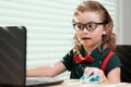 Online remote learning. School kids with computer having video conference chat with teacher in class. Child studying at Royalty Free Stock Photo