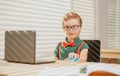 Online remote learning. School kids with computer having video conference chat with teacher in class. Child studying at Royalty Free Stock Photo