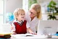 Online remote learning. School kids with computer