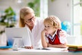 Online remote learning. School kids with computer