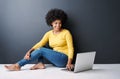 Online, remote work and black woman with laptop, studio and happiness on floor with education mockup. Computer, research